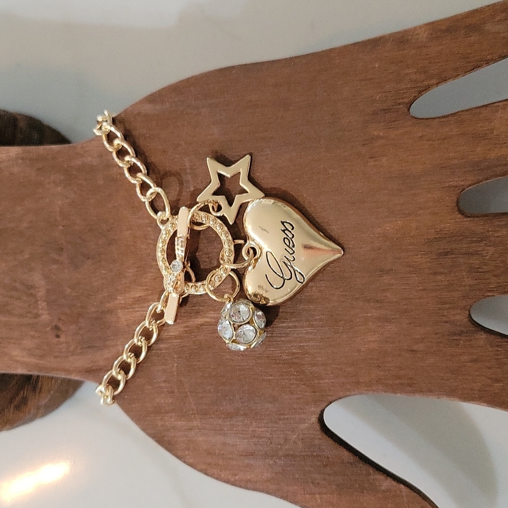 High Fashion 3 Charm Bracelet NWT  (gold in color)